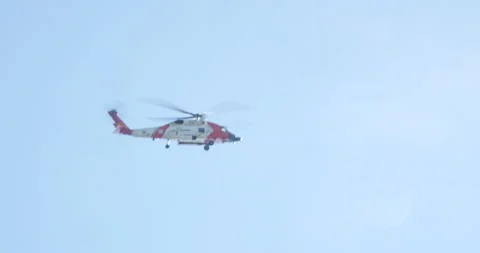Emergency helicopter flying view from ground in blue skies Stock Footage 171183392