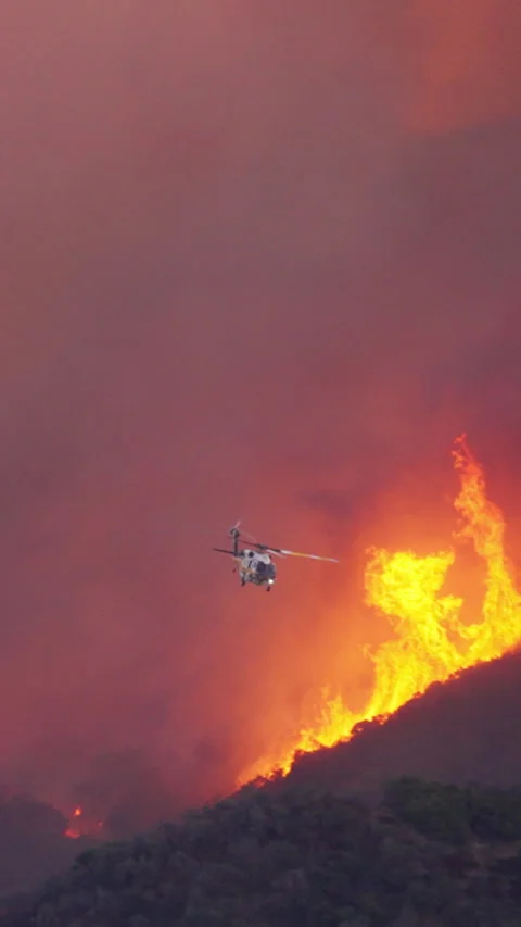 Emergency Helicopter Response to Wildfire Situation in Malibu, Los Angeles Stock Footage 299676781