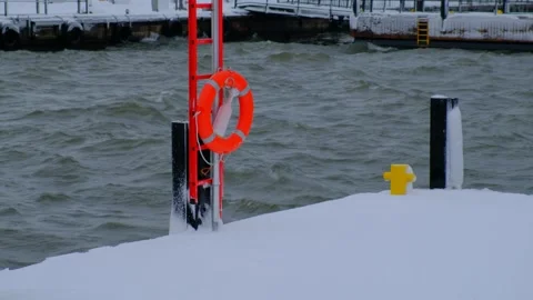 Emergency kit on the pier during the strong snowstorm. Stock Footage 148091560