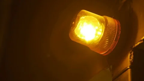 Emergency light or Flashing beacon. Orange flashing on wall  Stock Footage 99994993