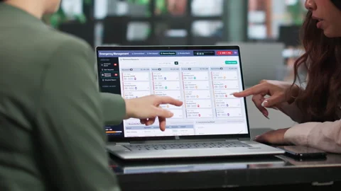 Emergency Manager Leads Team Using Software Stock Footage 347908167