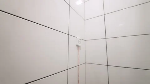 Emergency nurse call button with red cord on tiled wall 스톡 동영상 332044680