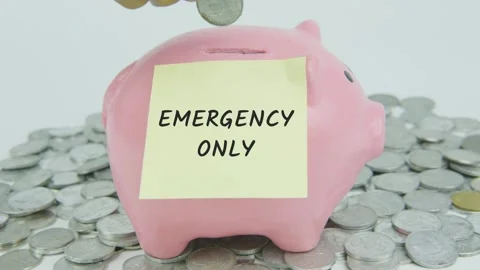 Emergency Only Word Or Text on Yellow Note Paper and Hand Inserting Coins Stock Footage 301502644