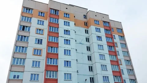An emergency panel house with cracks on the facade of the building. Resettlement Stockbeeldmateriaal 303620400