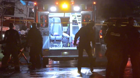 Emergency Personnel Putting A Victim Into The Back Of An Ambulance Stock Footage