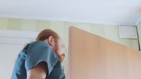 Emergency professionals arrive swiftly at residence for urgent care. Rapid Video stock 342337100