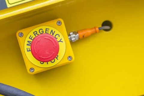 Emergency push stop button for hand press Stock Photos