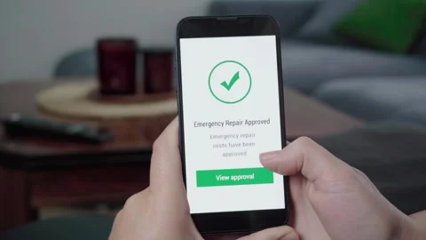 Emergency Repair Cost Approval Notification on Mobile Phone Stock Footage 343972242