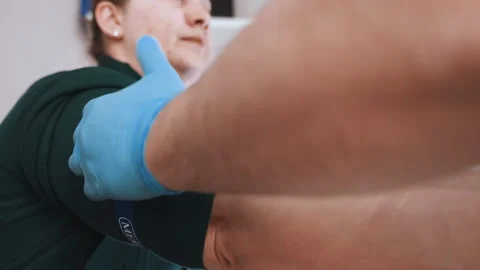 Emergency responder securing band around arm carefully. Healthcare professionals Video stock 342337752