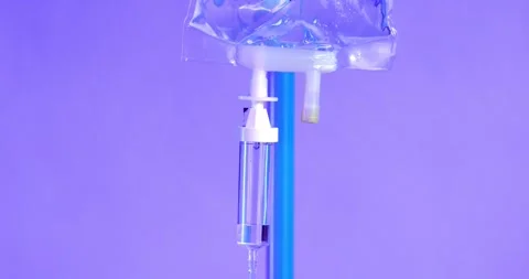 Emergency Response: IV Drip Equipment Illuminated by Ambulance Lights Stock Footage 260398291