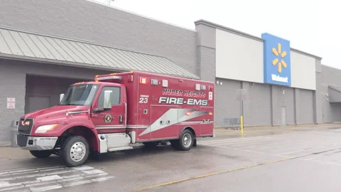 Emergency response vehicle with flashing lights at Walmart 4k 스톡 동영상 342777038