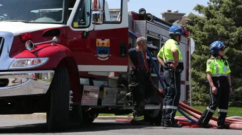 Emergency services at house fire Stock Footage 64222136