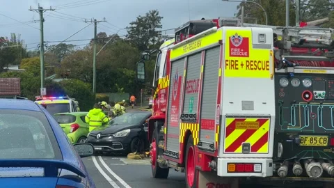 Emergency services work swiftly at the scene of a major two-vehicle Video stock 342578397