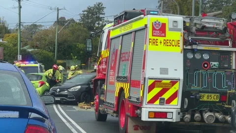 Emergency services work swiftly at the scene of a major two-vehicle Stock Footage 342578492