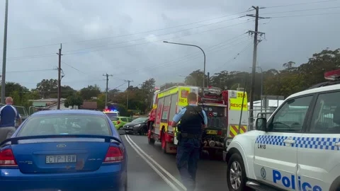 Emergency services work swiftly at the scene of a major two-vehicle Stock Footage 342578550