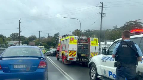 Emergency services work swiftly at the scene of a major two-vehicles Stockfoto's