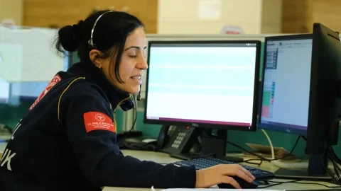 Emergency Staff Making Phone Call at Aid Service, February 8, 2023, Sanliurfa, Video stock 336516649