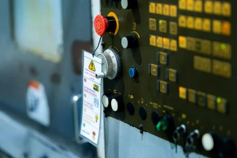 Emergency Stop Button and Safety Warning on Industrial Machine Control Panel Stock Photos