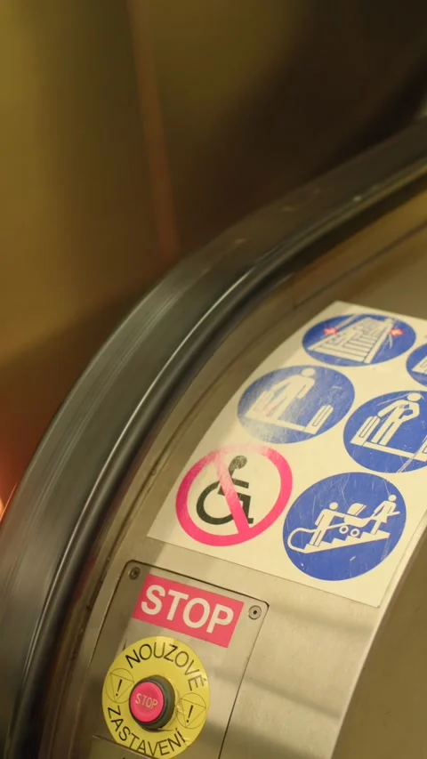 Emergency stop button and stickers on escalator handrail in station Stock Footage 347202283