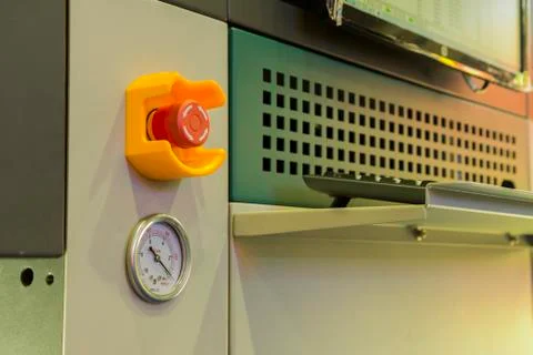 Emergency stop button and vacuum gage Stock Photos