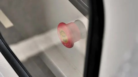 Emergency stop button behind the glass of a diesel generator Stock Footage 217373605