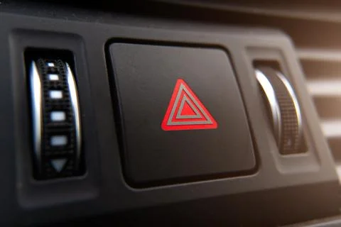 The emergency stop button of the car is a close-up on the dashboard. Stock Photos