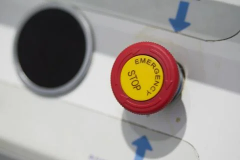Emergency Stop Button located on the Machine Control Panel for safety Stock Photos