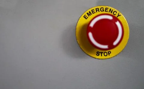 Emergency stop button switch on  control panel In a industry Stock Photos