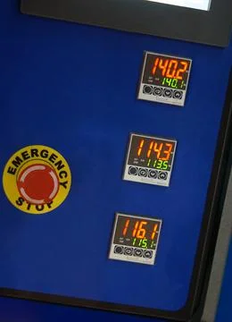 Emergency stop  system on a control panel in an industry Stock Photos