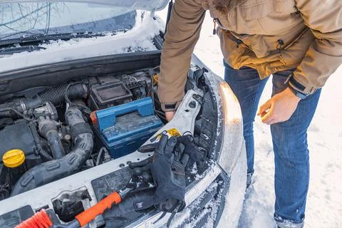 Emergency stop in winter. Car with opened car hood. Stock Photos