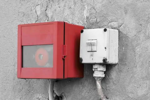 Emergency switch and light switch on the facade of a factory building Fotos de archivo