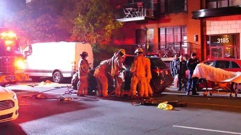 Emergency team using jaws of life on a major automobile accident Stock Footage 100618808