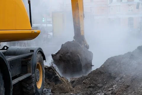 Emergency unicipal services working on liquidation of hot water pipeline Stock Photos
