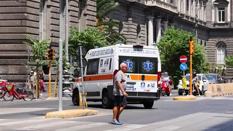 Emergency Vehicle Navigates Busy Naples Street Stock Footage 301939853