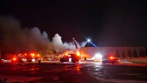 Emergency vehicle on-scene of structure fire with heavy smoke Stock Footage 103632959