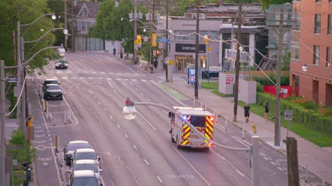 Emergency Vehicles Responding to a call at sunset Stock Footage 339631861