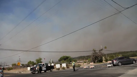Emergency vehicles at road block for fire Stock Footage 114414887