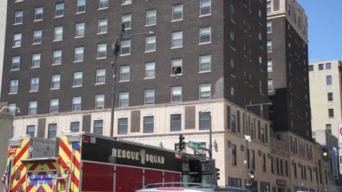 Emergency vehicles wait while  negotiations go on with a woman contemplatin.. Video stock 250361378