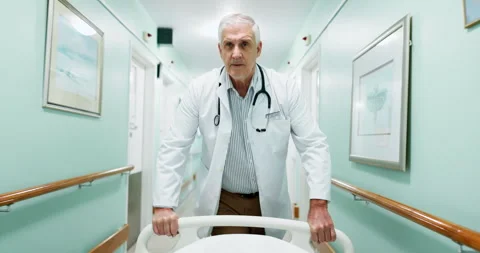Emergency, walking and surgeon with bed in hospital for operation, icu or ER Stock Footage 340880393