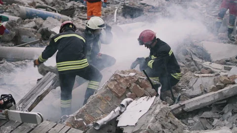 Emergency workers removing rubble together Stock Footage 166144140