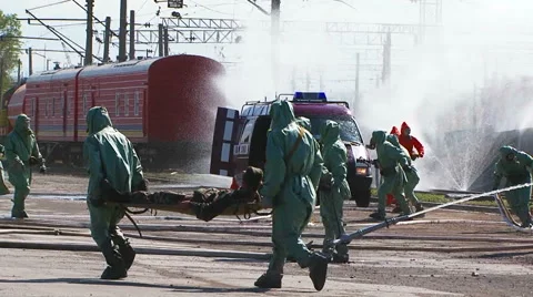 Emergency Workers Saving People And Watering Tanks At Railway Stock Footage 57526028
