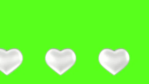 Emerging big silver hearts against a green screen. 3D animation. Stock Footage 247493732