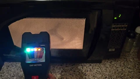 EMF meter measuring microwave oven in Off mode. Stock-Footage 261625434