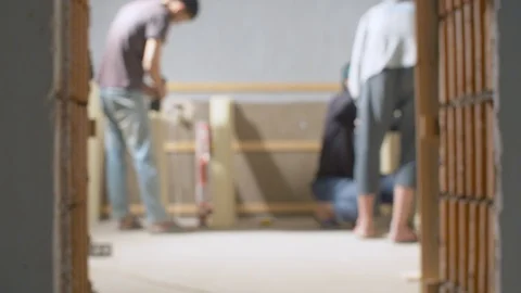 Emigrant workers in a house under construction Video stock 114570424