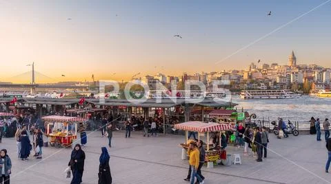 Eminonu Piazza before sunset with floating seafood restaurants Stock Photos