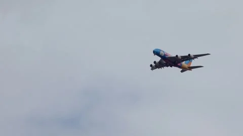 An Emirates Airlines plane passing through low cloud. Stock Footage 277946788