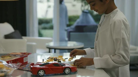 Emirati boy stacking lego blocks Stock Footage 105805071