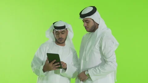 Emirati businessmen using digital tablet. Stock Footage 54479377