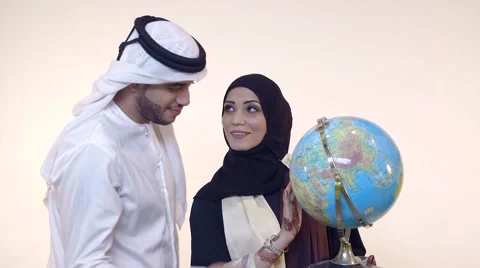 Emirati couple looking at globe. Stock Footage 54487569