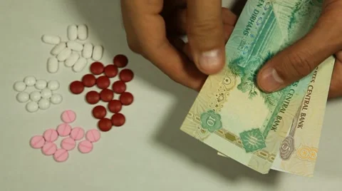 Emirati Dirham AED, Counting Drugs and Money, Health Care, Colorful Pills Stock Footage 8679207